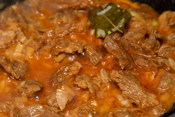 Tuscan lamb ragout simmering